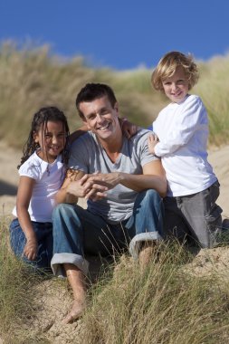 Father, Son & Mixed Race Daughter Sitting on Beach clipart