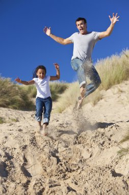 Man & Girl, Happy Father and Daughter Jumping At Beach clipart