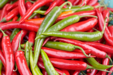 Red & Green Chillies For Sale in Market clipart