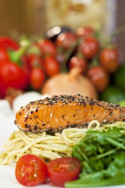 Peppered Salmon Fillet with Spaghetti Pasta Tomatoes and Green S clipart