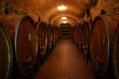 Barrels of Chianti Wine in a Winery Cellar clipart