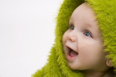 Smiling Baby Wrapped In Green Blanket or Towel clipart