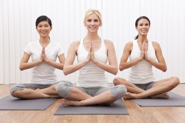 Interracial Group of Three Beautiful Women In Yoga Position clipart