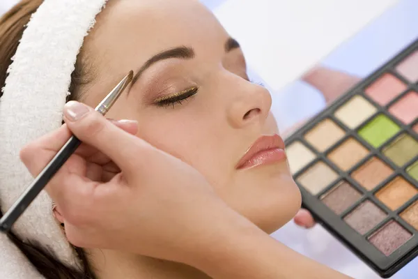 Beautiful Woman Having Make Up Applied by Beautician at Spa — Stock Photo, Image