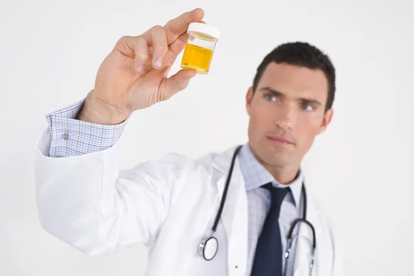 Concerned Doctor With Sample — Stock Photo, Image