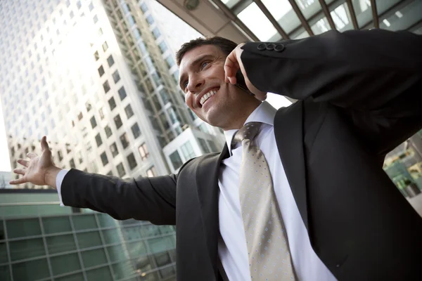 Businessman On His Cell In The City — Stock Photo, Image
