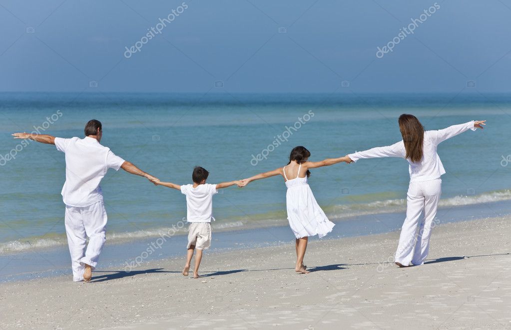 Mother, Father and Children Family Holding Hands At Beach Stock Photo by  ©dmbaker 6486959