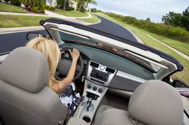 Beautiful Young Woman Driving Convertible Car clipart