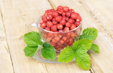 Strawberries in a glass bowl. clipart