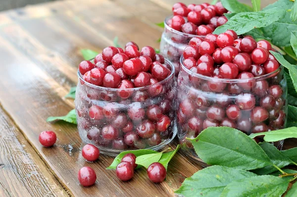 Cherries in glass jars. — Stock Photo, Image