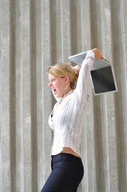 Corporate Female Executive smashing notebook clipart