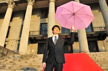 bir şemsiye ile Asya adam kavramsal pic