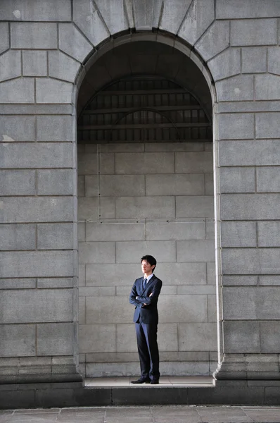 stock image Asian Chinese Man standing in the arch of a roman architecture