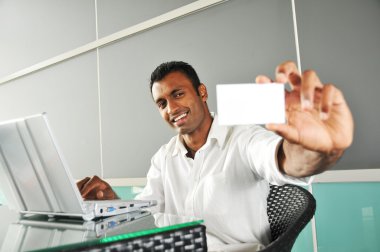 Indian Man holding up a name card clipart