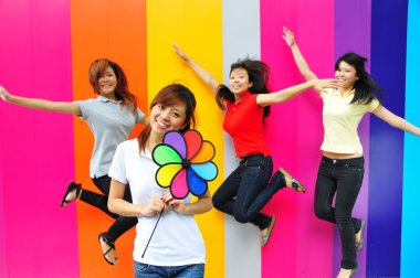 Four asian girlfriends in various poses clipart