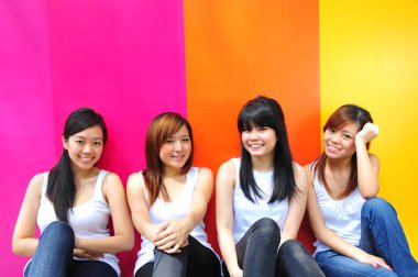 Four asian chinese girls in various poses clipart