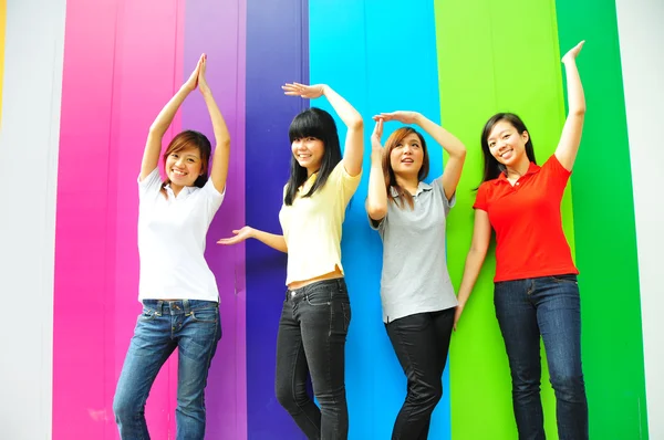 Four asian girlfriends in various poses — Stock Photo, Image