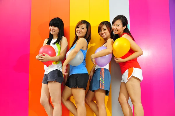 Bright cheer leaders with colorful background — Stock Photo, Image