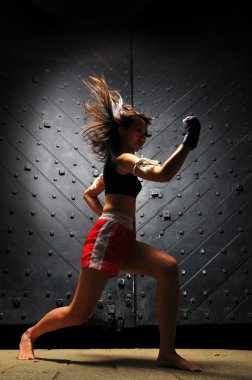 Asian Chinese Thai Girl in Muay Thai poses clipart