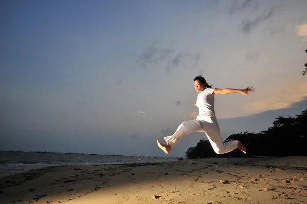 Asian Chinese Girl leaping with joy — Stock Photo, Image