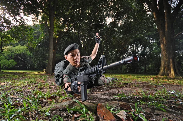 Asian chinese soldier in various aggressive poses — Stock Photo, Image