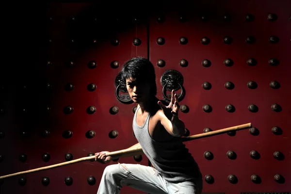 Homme asiatique chinois Kungfu combattant dans diverses poses Images De Stock Libres De Droits
