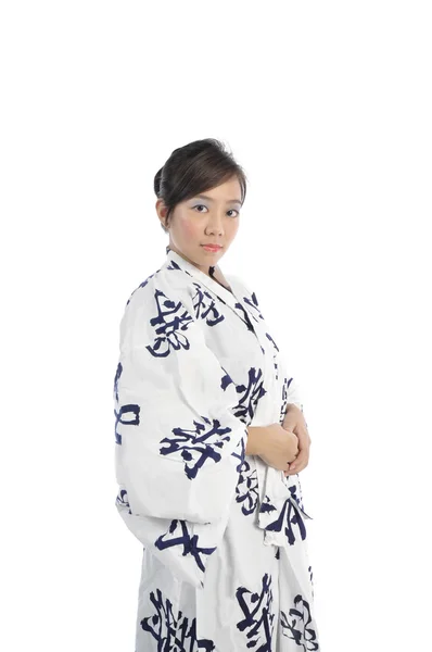 Japanse meisje in yukata en in verschillende poses — Stockfoto