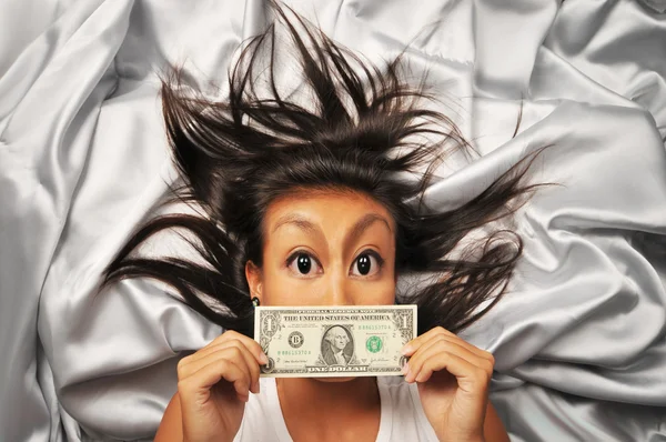 Asian Chinese woman with a US dollar bill Stock Photo