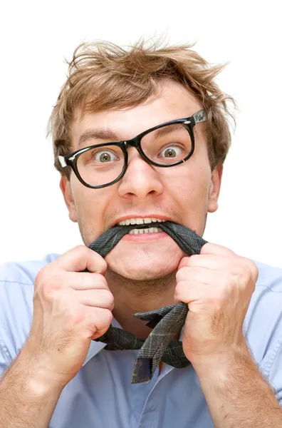 Crazy businessman with a tie in the mouth — Stock Photo, Image
