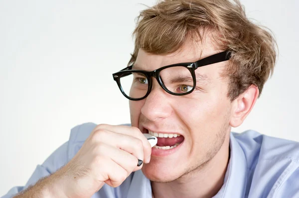 Angry manager eats phone — Stock Photo, Image