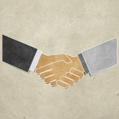 Shaking hands recycled paper craft stick on paper background clipart