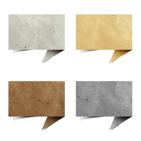 Burbuja hablar etiqueta papel reciclado artesanía palo sobre fondo blanco —  Fotos de Stock
