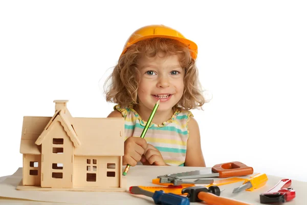 Happy child builds house — Stock Photo, Image