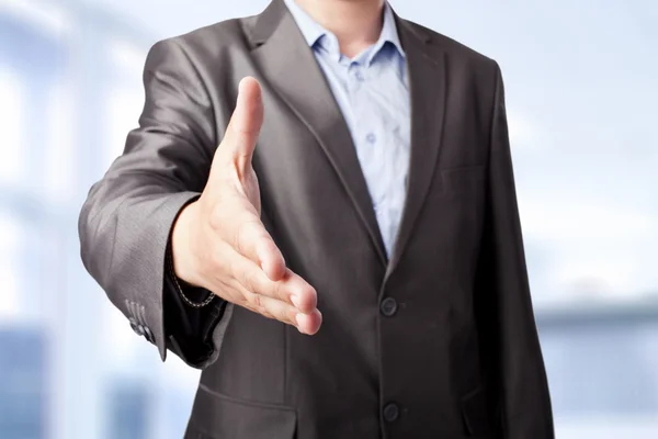 Businessman extending hand to shake isolated on white background — Stock Photo, Image