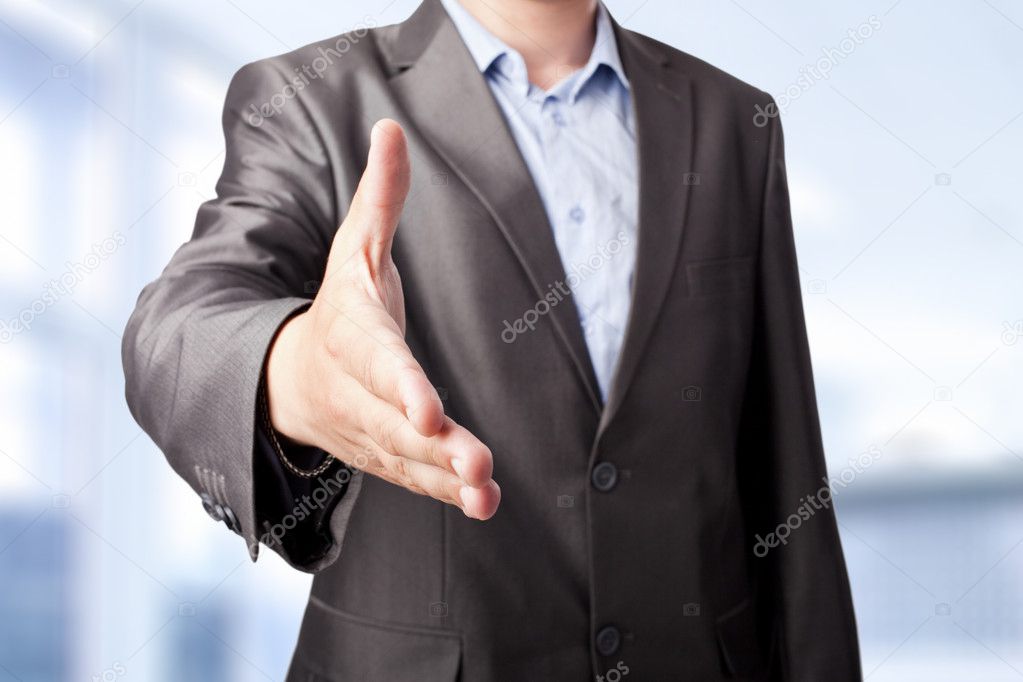 Businessman extending hand to shake isolated on white background