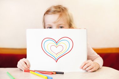 Little girl holding album with hearts. Valentine's Day clipart