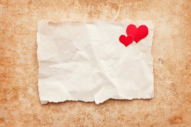 Ripped piece of paper on grunge paper background. Love letter clipart