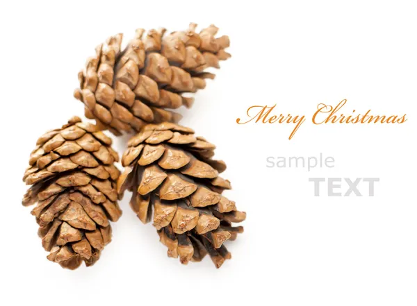 Três cones de Natal isolados em fundo branco com spa cópia — Fotografia de Stock