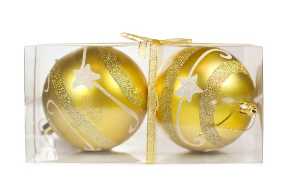Two Christmas golden balls in transparent box isolated on white — Stock Photo, Image
