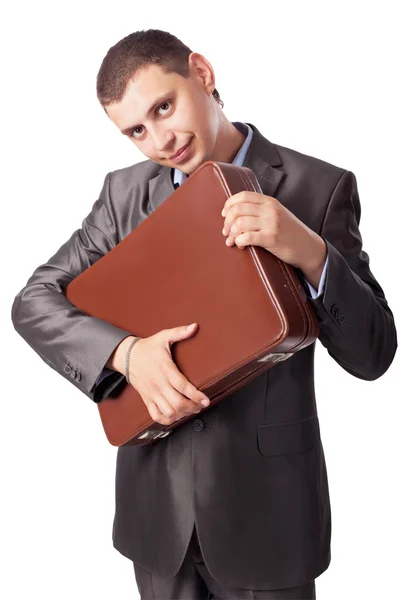 Giovane uomo d'affari abbraccia portafoglio isolato su backgrou bianco — Foto Stock