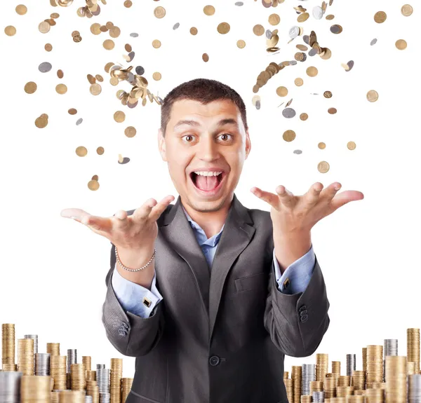 Happy rich businessman enjoying success throws up many coins iso — Stock Photo, Image