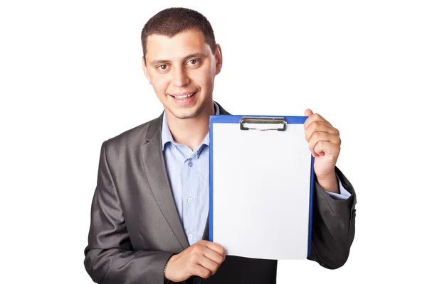 Улыбающийся молодой бизнесмен держит планшет изолированным на белой ба — стоковое фото