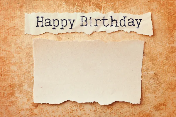 Paper with ripped edges on grunge paper background. Happy birthd — Stock Photo, Image