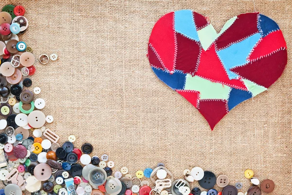 Fabric scraps heart on texture background. Valentine's Day. Butt — Stock Photo, Image