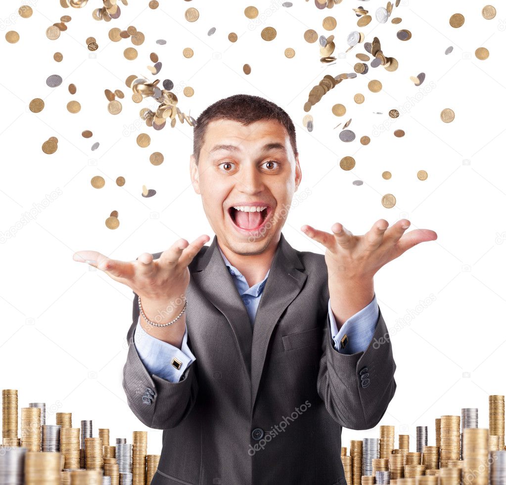 Happy rich businessman enjoying success throws up many coins iso