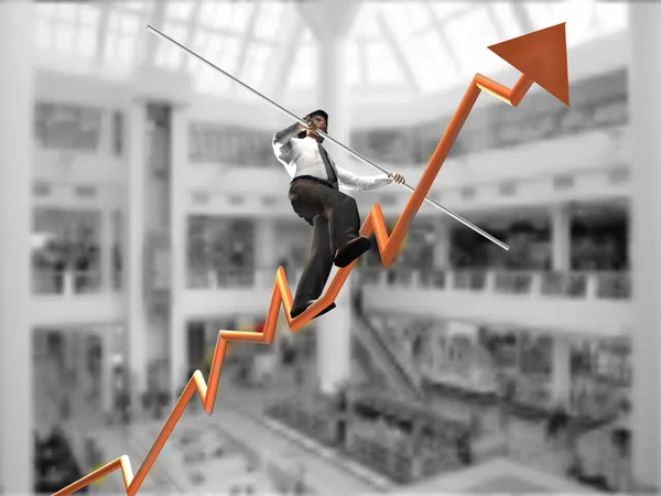 Empresario en un gráfico de finanzas con el objetivo de la parte superior — Foto de Stock