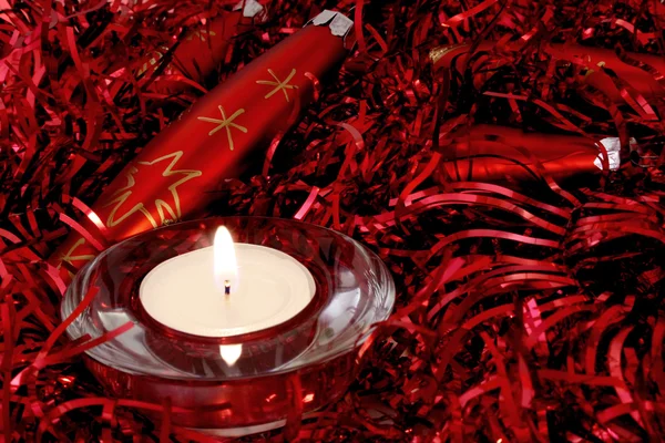 Red Christmas ornaments and candle — Stock Photo, Image