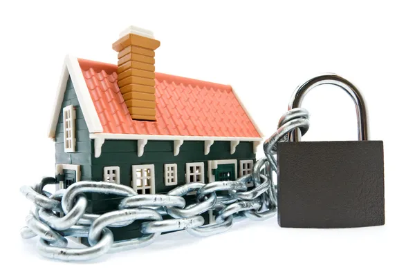 House in chains locked with padlock — Stock Photo, Image