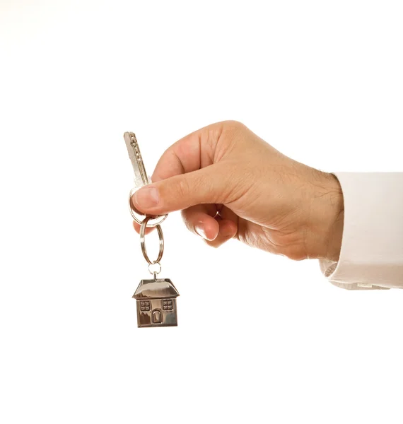 Mão segurando chave da casa — Fotografia de Stock