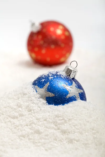 Christmas baubles in snow — Stock Photo, Image